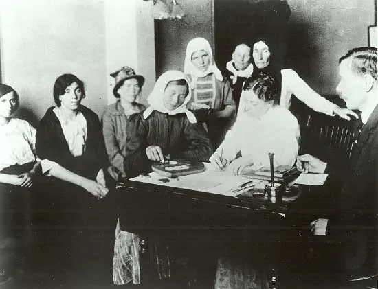 Immigrants registering inside Ellis Island